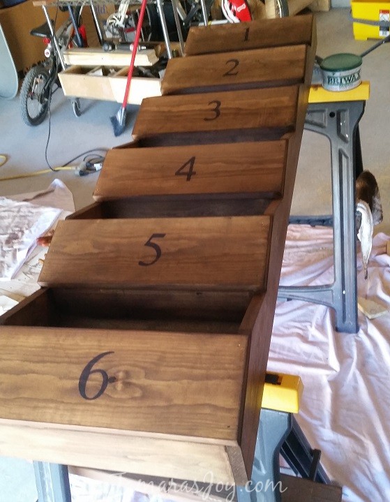 How to build your very own mitten storage! It cleans up the mudroom & helps the kids keep things organized in a simple way. Tamarasjoy.com