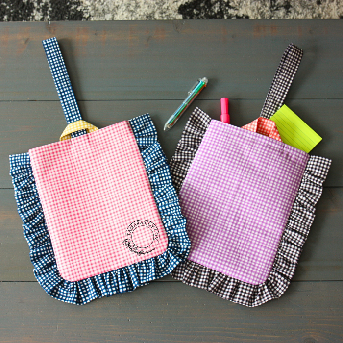 two ruffle purses side by side on a table
