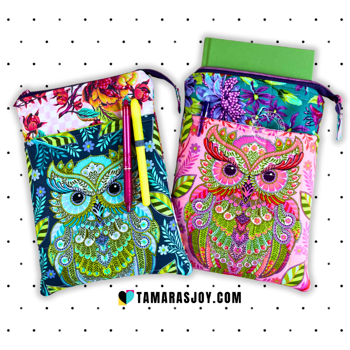 Two colorful owl-patterned bags with pens on a white background, featuring the brand 'TamarasJoy'.
