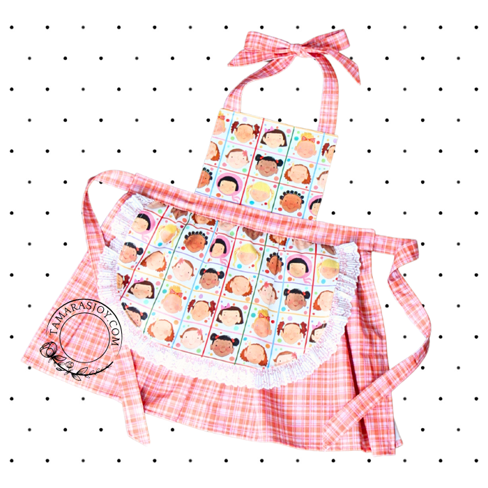 front of the apron in a print with kids faces on it.